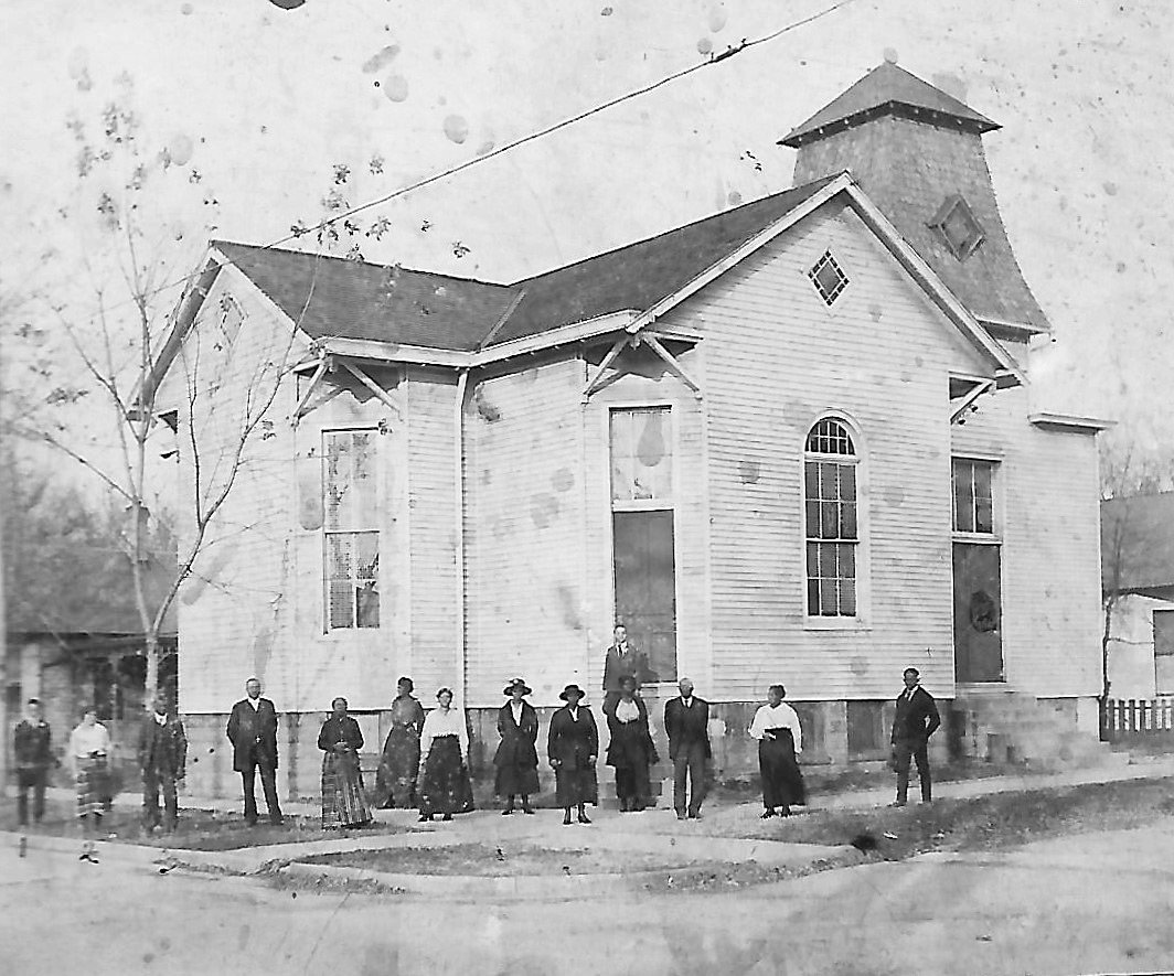 The Second Baptist Church was built in 1892 at Washington and Jefferson streets. This photo is dated 1922 and the people in the photo are: left to right, Carson Bradey, Esther Bradey, Deacon George McGraw, the Rev. Haley, Betty Easters, Mrs. Haley, Susie Thomas, Stella Parker, Mrs. Willie Mathis, Margaret Turner, Deacon Henry Artis, Mary L. Thomas and Weston Tolliver. William Bradey is standing on the church steps.