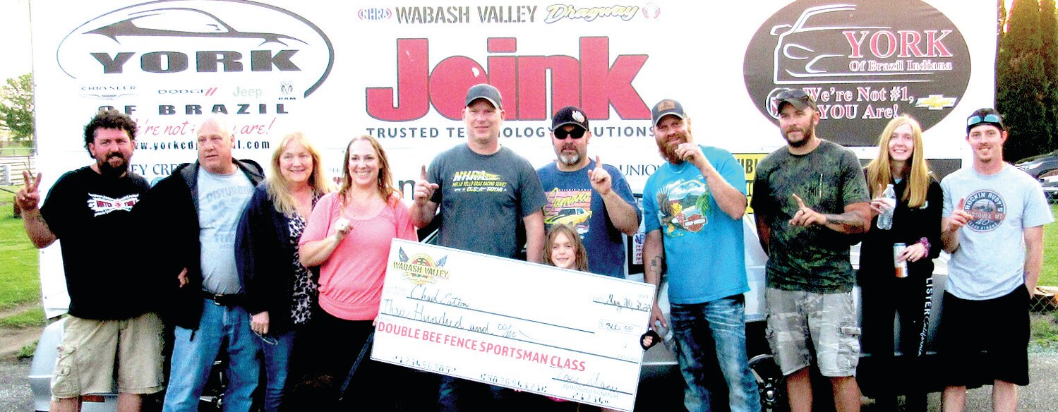 Local drag racer Chad Eaton recently won the Sportsman Class at Wabash Valley Dragway. Pictured left to right are, Eric Joslin, Joel Leihser, Lori Leihser, Brandi Eaton, Chad Eaton, Chris Walker, Kaylie Eaton, holding the check, Joey Higgins, Michael Kruzan, Katie Shryock and Lucas Cook.