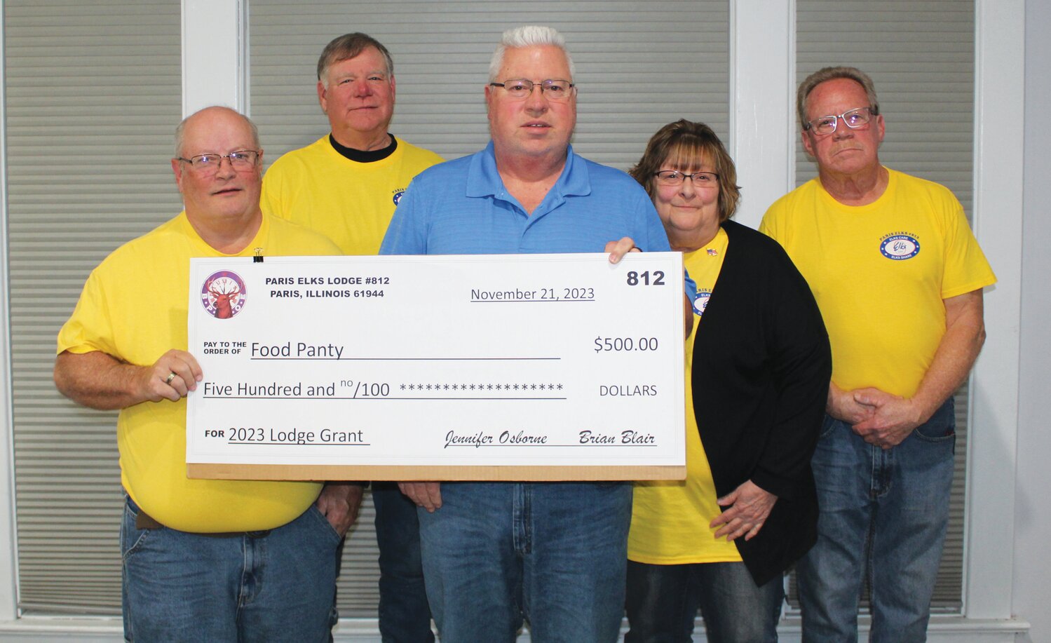 Glenn Strow (center) accepted a $500 donation on behalf of the Food Pantry from multiple members of the Paris Elks Lodge #812.