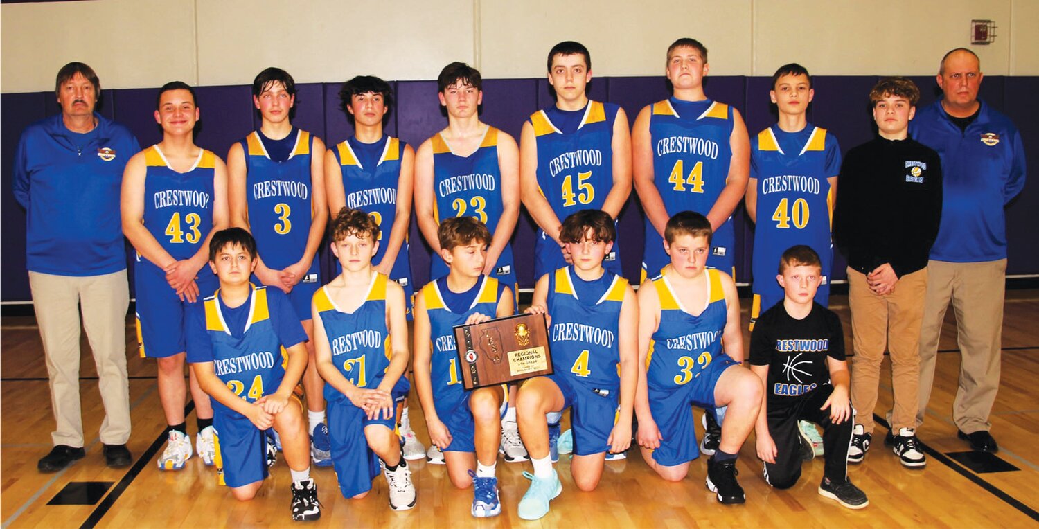 Members of the eighth-grade Crestwood basketball team pose with their regional title plaque. From left to right, in front, Drake Quinn, Will Dennis, Gage Englum, Keegan Jewell, Mason Little and Coby Beals. In back, Assistant Coach Gary Abernathy, Keagin Luster, Marcus Hutchings, Drew Kirby, Carter Breeding, Wyatt Watson, Briar Good, Brody Stults, Easton McNabb and Head Coach Chad Beal.